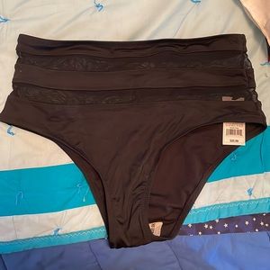 Black swim bottoms with mesh striped waist